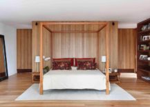 Classic-four-poster-bed-for-the-modern-bedroom-with-accent-wood-wall-217x155