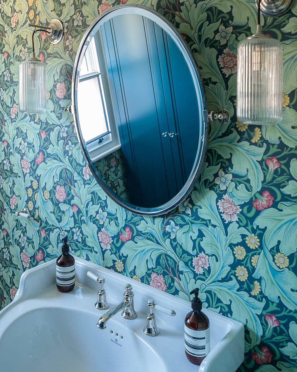 Colorful and bright wallpaper for the small powder room that is beautifully lit