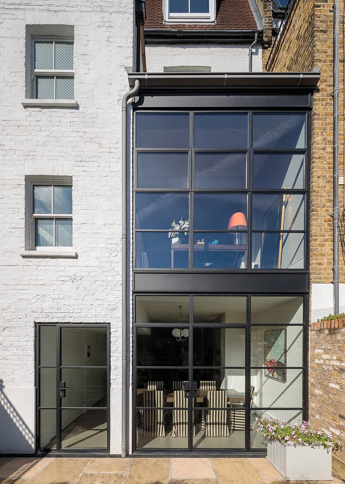 Combining the classic brick walls of traditional British homes with glass windows