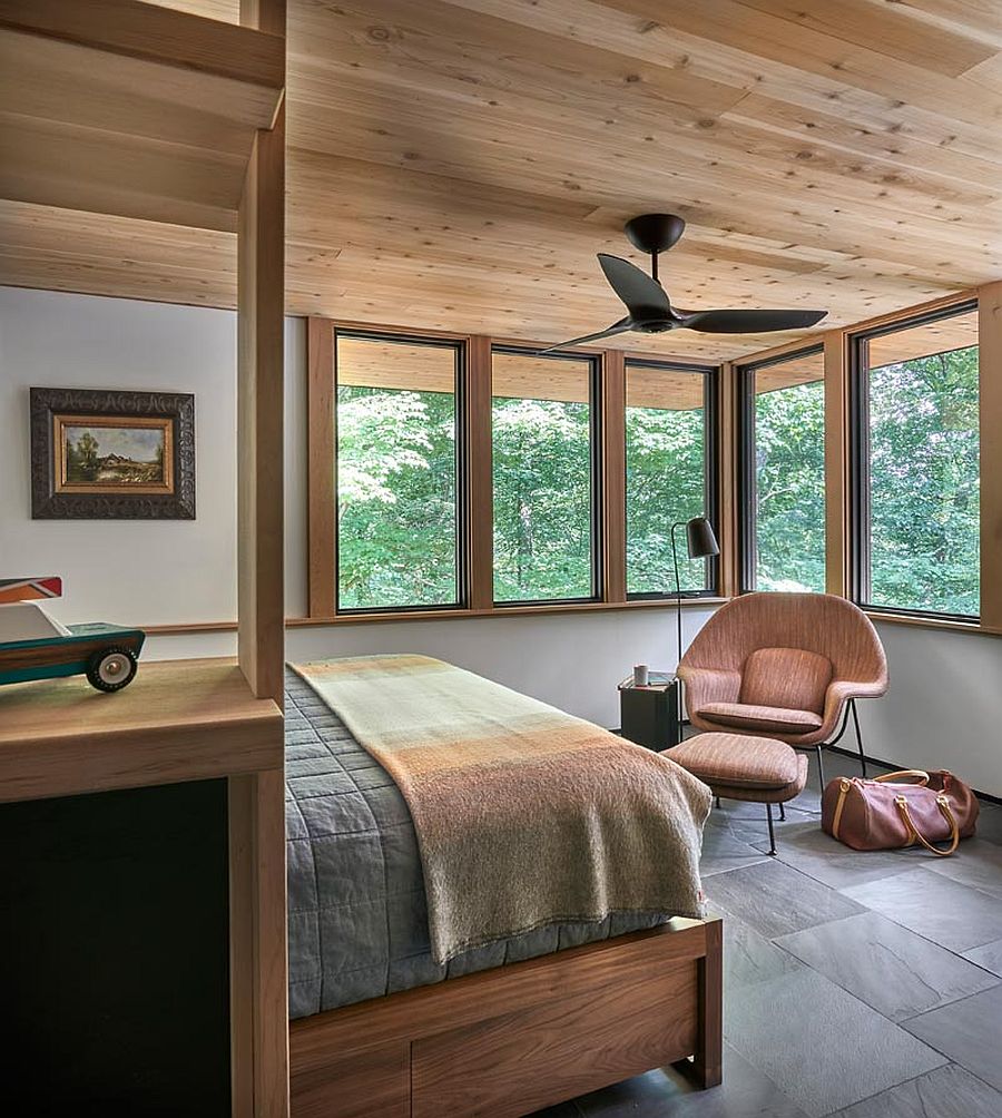 Comfortable and elegant cabin bedroom with stone and wood shaping it