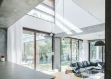Concrete-slabs-wood-and-polished-interior-shape-the-house-with-sweeping-public-areas-217x155