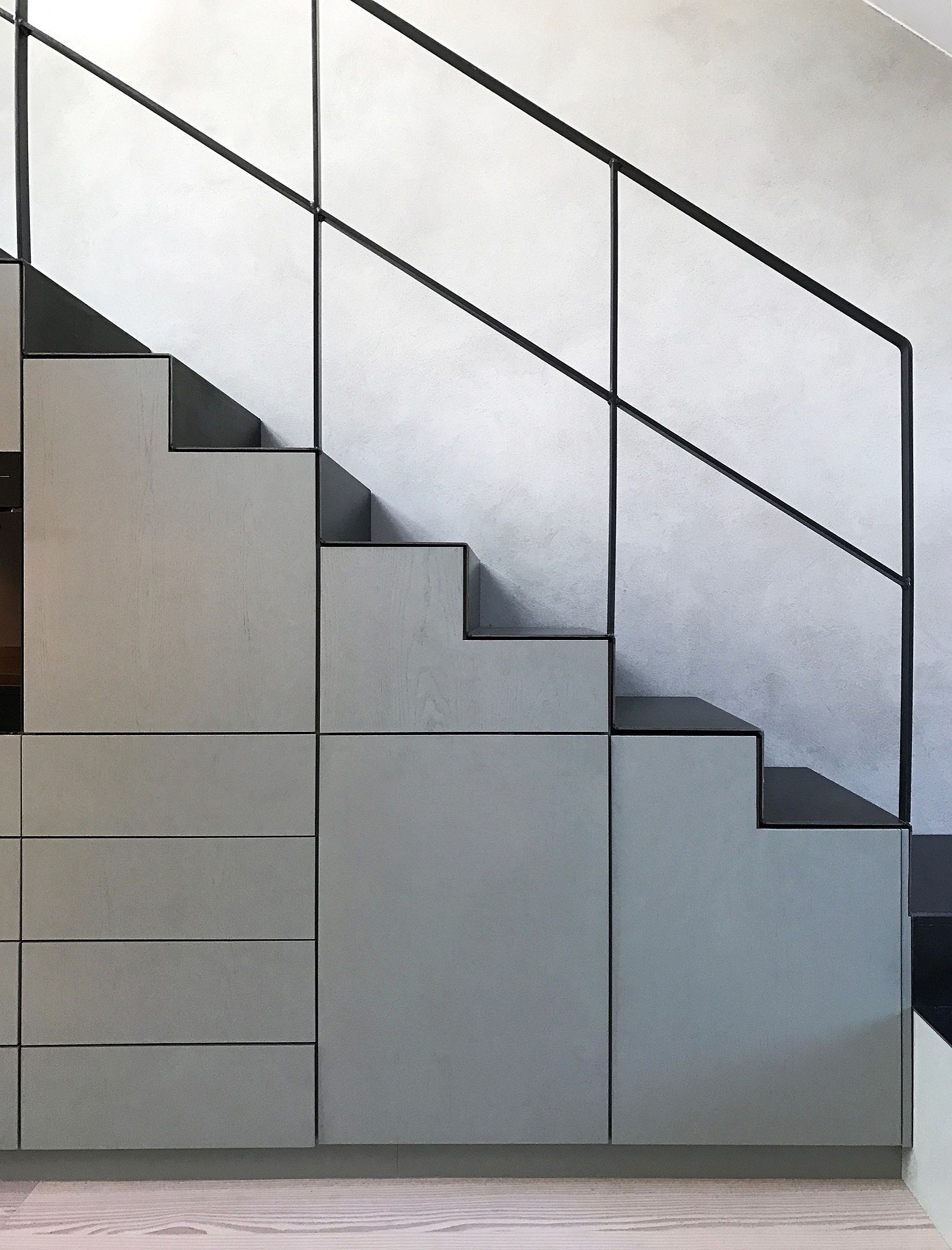 Contemporary and minimal staircase with built-in storage