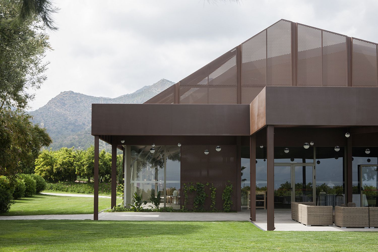 Corten steel structure creates fabulous outdoor spaces protected from the sun