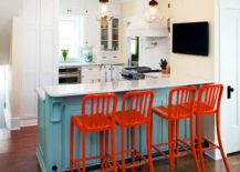 Create-a-lovely-focal-point-at-the-breakfast-bar-with-bright-red-bar-stools-217x155