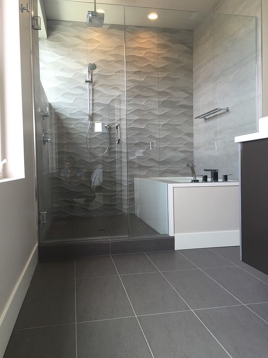 gray modern bathroom with glass shower.