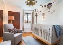 Custom-wall-decal-in-the-backdrop-makes-for-an-interesting-visual-in-the-small-eclectic-nursery-with-ample-natural-light-217x155