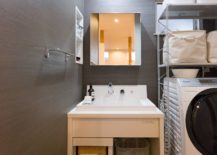 Dark-backdrop-for-the-small-laundry-with-plenty-of-space-savvy-features-217x155