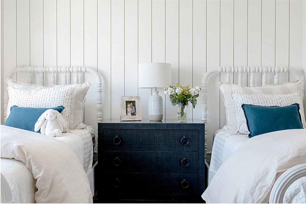 Dashing pops of dark blue for the cheerful beach style bedroom