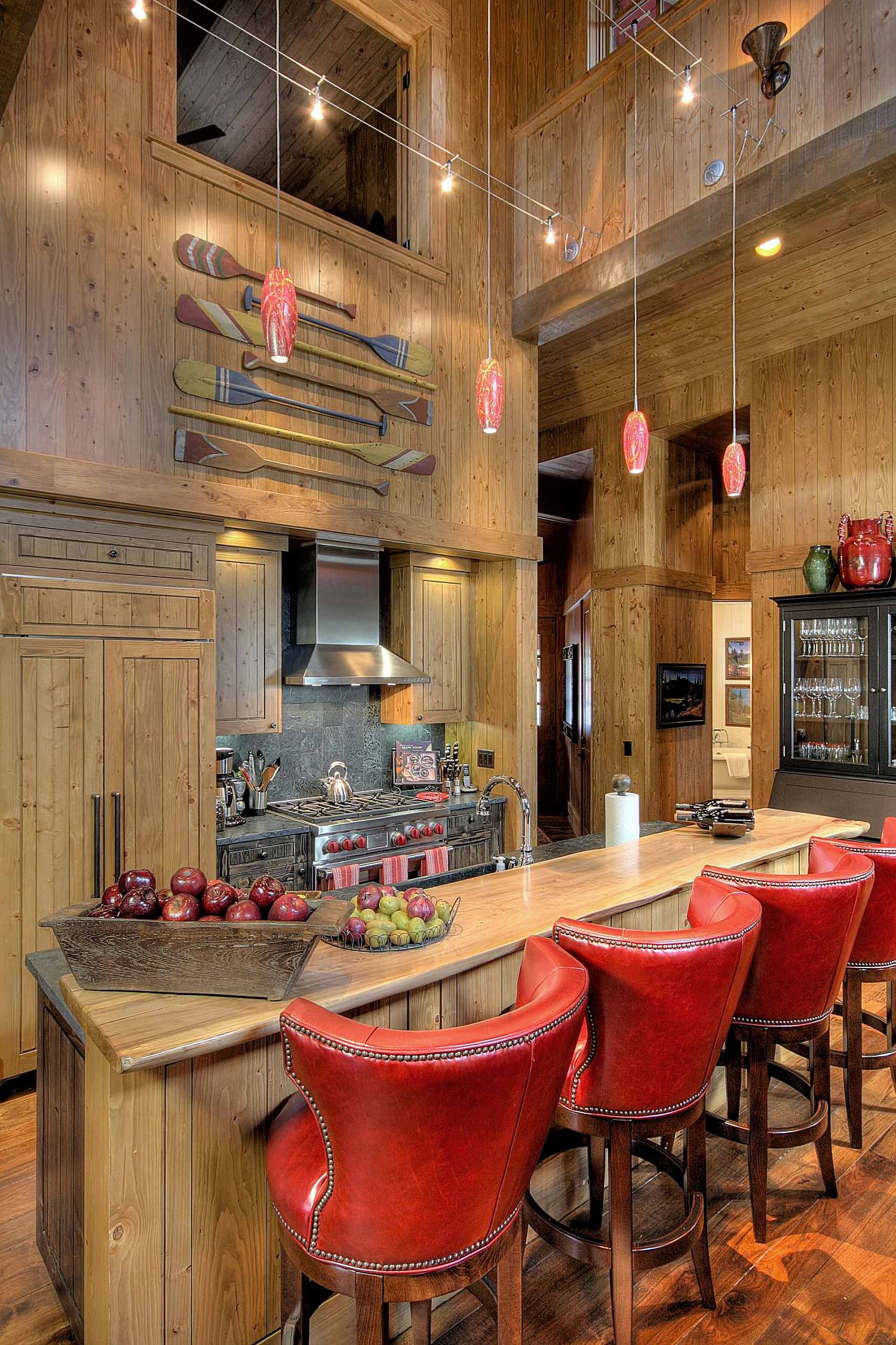 Delightful blend of wood and red in the spacious rustic kitchen