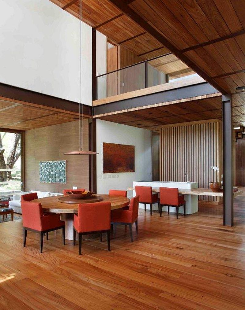Double height dining room and living area of the modern Brazilian home