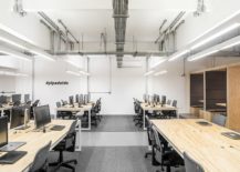 Exposed-duct-pipes-and-the-flooring-bring-industrial-charm-to-the-modern-workspace-217x155