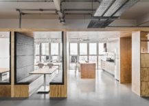Exposed-industrial-elements-are-coupled-with-modernity-inside-this-multi-level-Brazilian-office-217x155