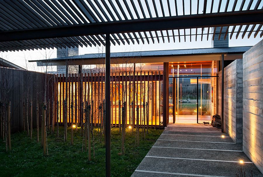 Exquisite illuminated concrete walkway outside the modern New Zealand home