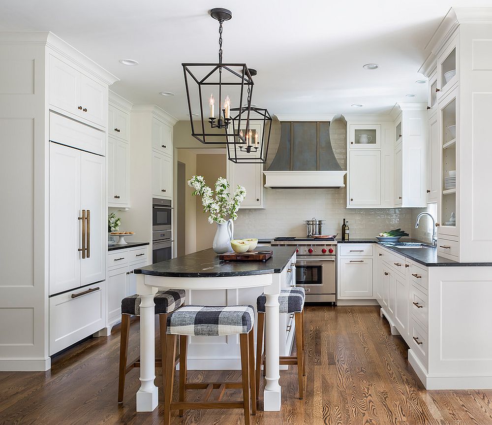 Extended kitchen island with breakfast bar that has classic bar stools to complement its look