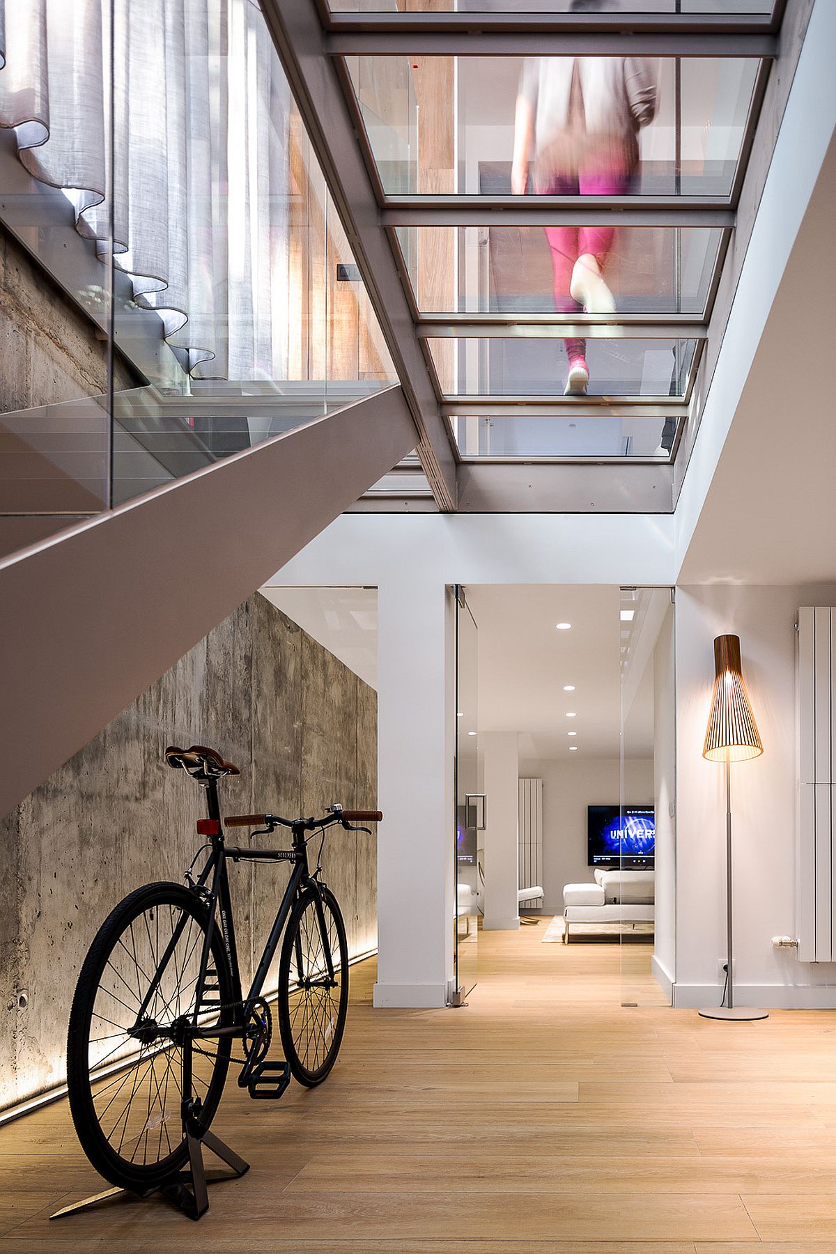 Fabulous glass staircase brings light into variors levels of the house while creating a lovely focal point