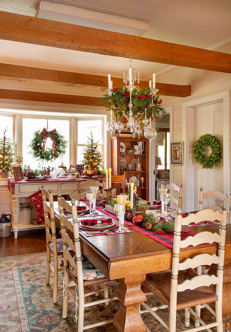 Farmhouse style dining room decked out with Christmas decorations everywhere