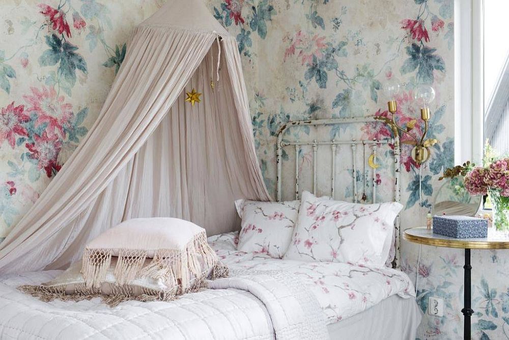 Flowery pattern for the walls sits perfectly into the narrative of the bright shabby chic kids' room