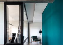 Framed-glass-walls-bring-in-natural-light-while-the-dark-green-walls-hold-your-attention-217x155