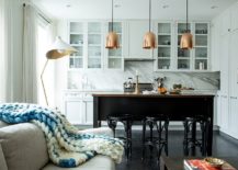 Glittering-metal-pendants-stand-in-contrast-to-the-light-white-backdrop-and-marble-backsplash-217x155
