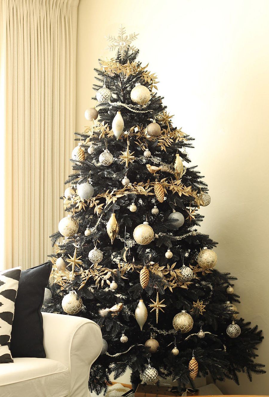 Gorgeous black Christmas tree decorated in gold feels both chic and unique