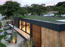 Green-roof-of-the-prefab-coupled-with-solar-panels-powers-the-home-217x155