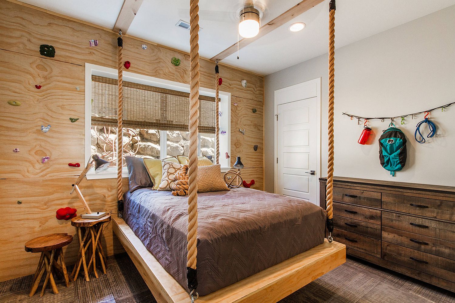 Hanging-bed-and-custom-climbing-wall-in-wood-for-the-small-kids-room