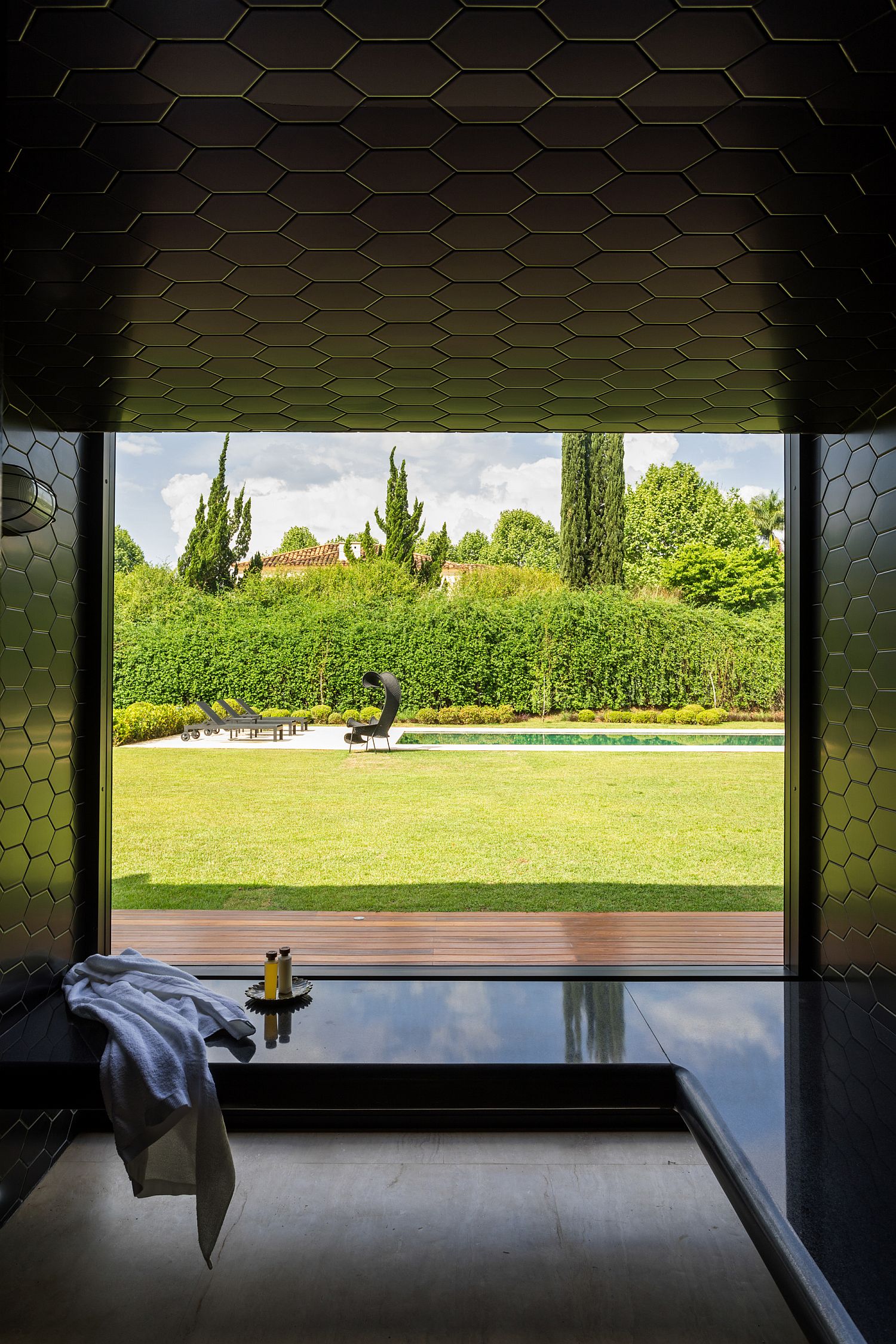 Hexagonal ceiling tiles in black for the contemporary bathroom