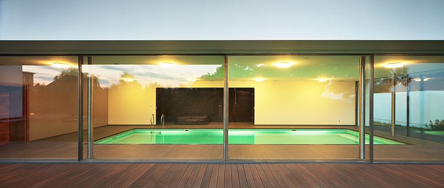 Indoor pool of the house with glass walls all around