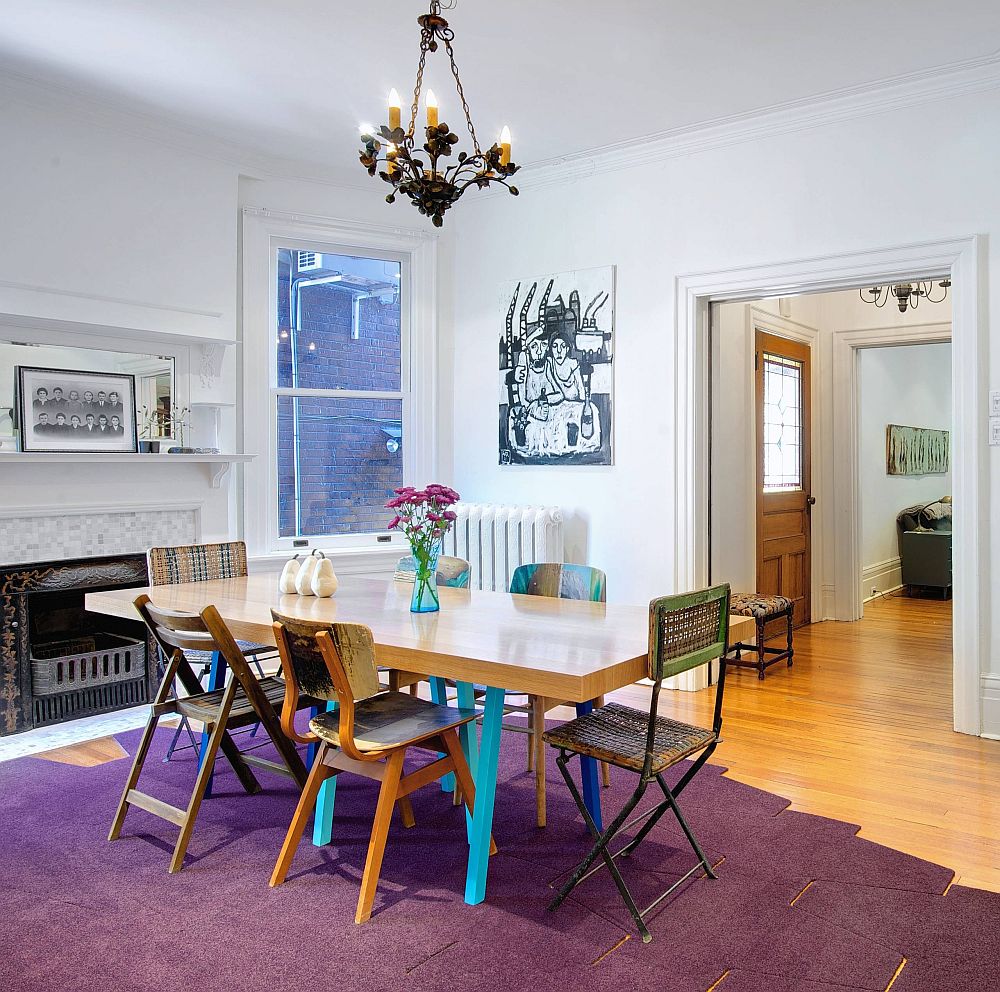 Lovely purple rug adds plenty of brightness to this contemporary dining room in neutral colors