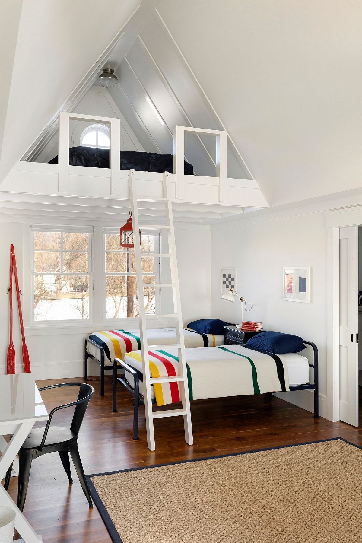 Making most of the vertical space in the all-white beach style bedroom