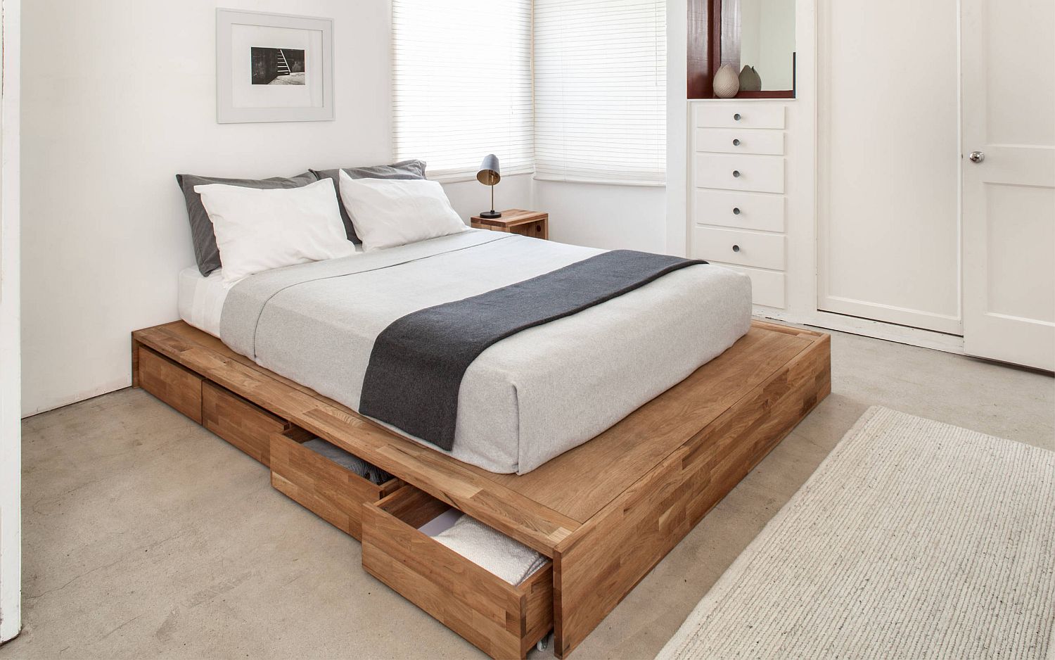 Minimal bed frame and Scandinavian style of the room give it a more spacious appeal