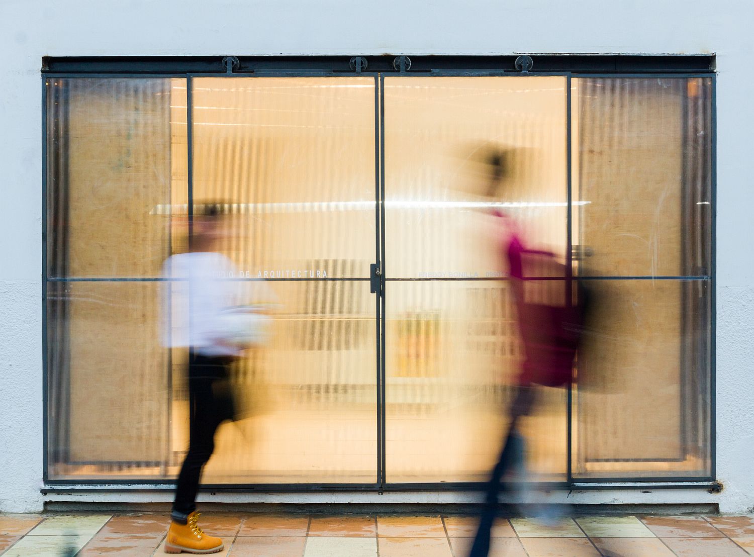 Minimal design of the office entrance allows the large mural to take centerstage