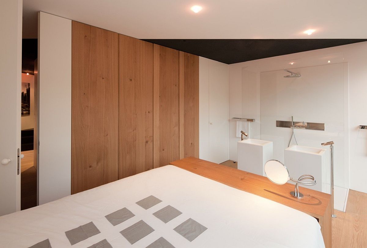 Modern minimal master bedroom and bathroom in wood and white