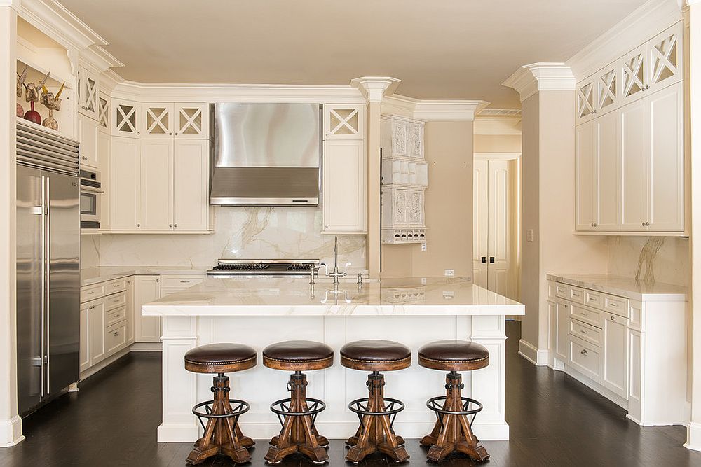 Monochromatic white and cream kitchen with bar stools that stand out visually