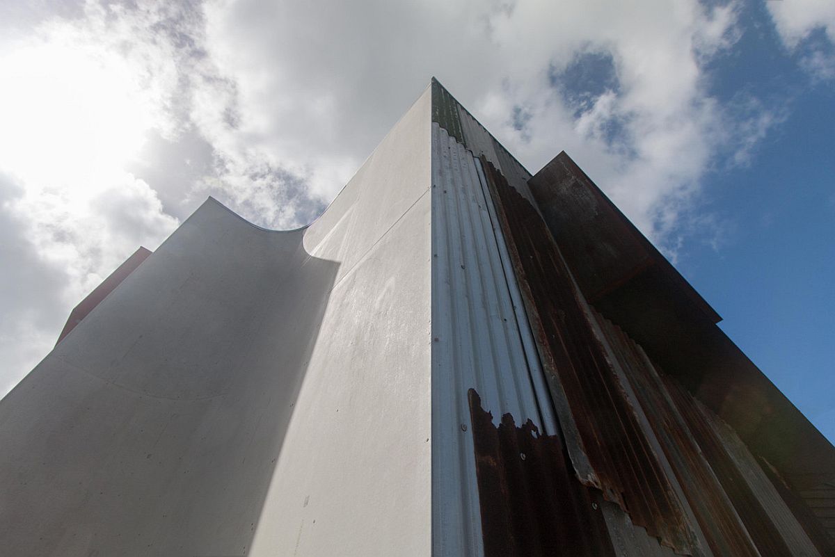 New timber structure replaces the old tin shed but with a rusted, industrial sheen