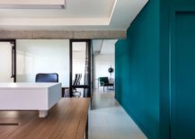 Porcelain-flooring-wood-and-white-walls-and-engaging-green-accents-inside-the-office-217x155