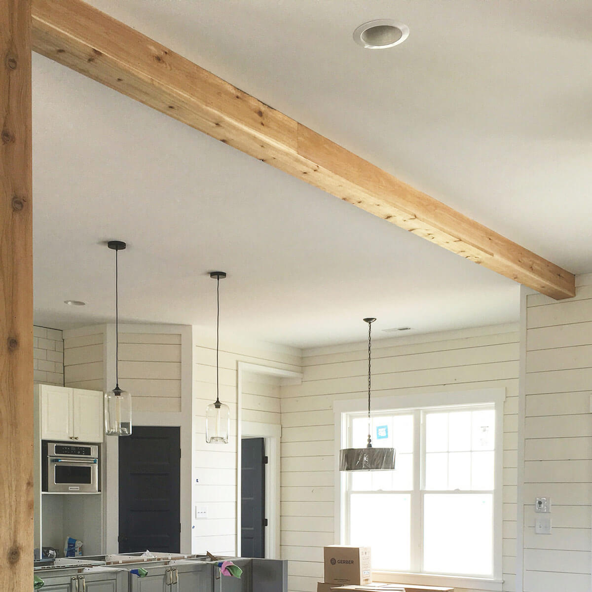 Rustic Unfinished Beams With White Painted Shiplap
