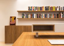 Series-of-floating-wooden-shelves-hold-books-and-other-accessories-217x155