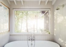Skylight-brings-ample-natural-light-into-the-small-bathroom-with-tiled-floor-217x155