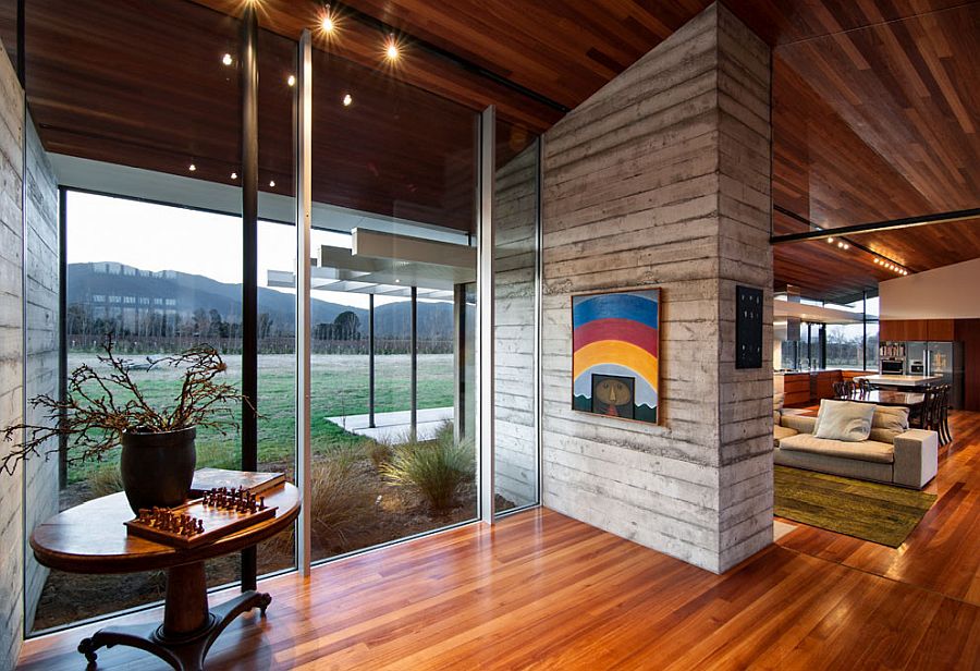 Sliding glass walls connect the interior of the New Zealand home with the natural scenery outside