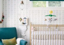 Small-eclectic-nursery-with-a-pop-of-dark-green-and-a-neutral-backdrop-217x155