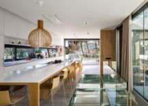 Spacious-wood-and-white-kitchen-and-dining-space-that-offers-perfect-vantage-point-inside-the-house-217x155