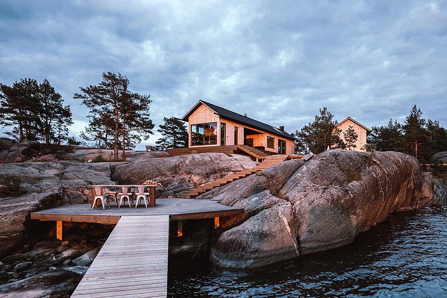 Steps leading to the deck along with a great outdoor dining area on the edge of water