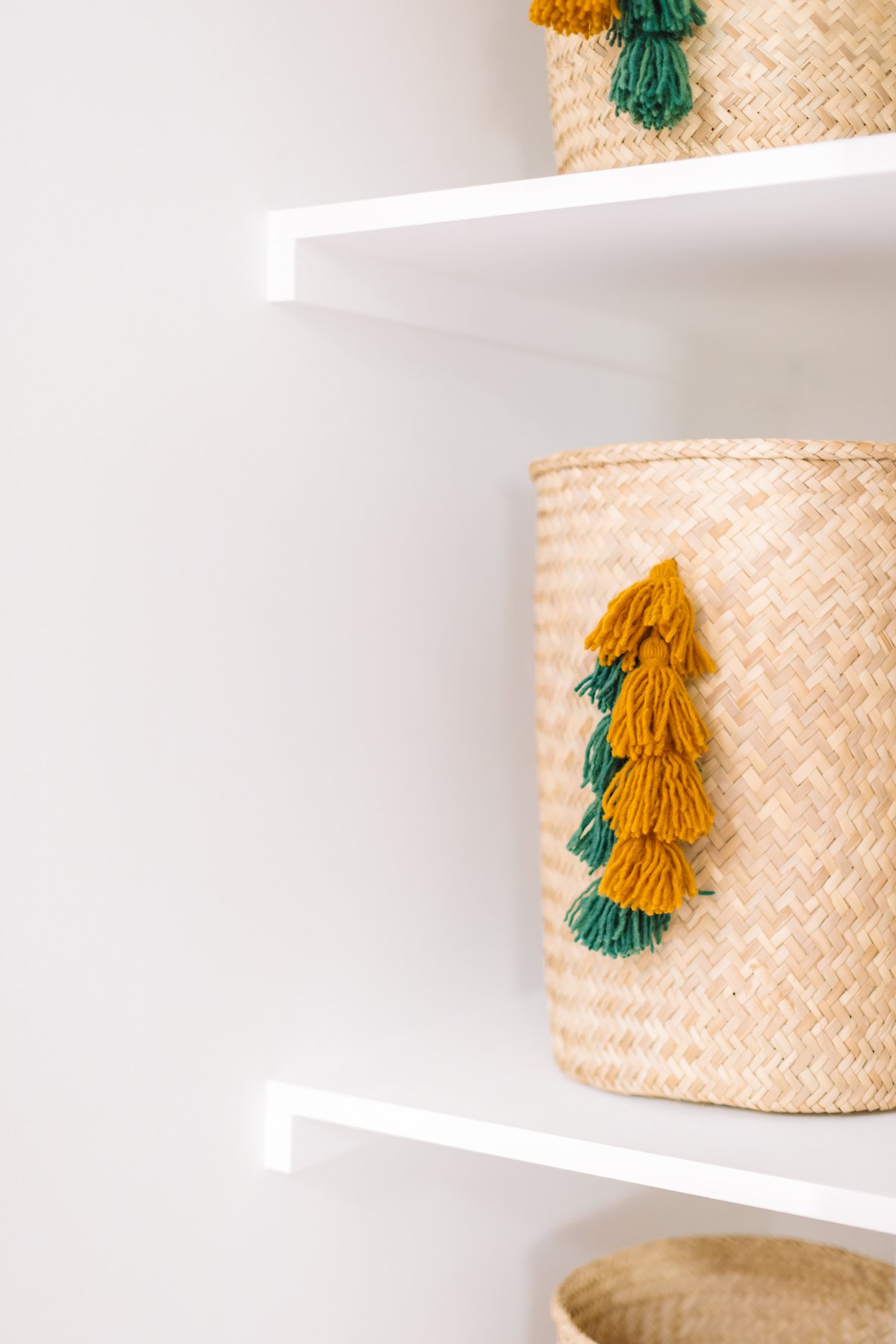 Storage baskets with green and yellow tassels