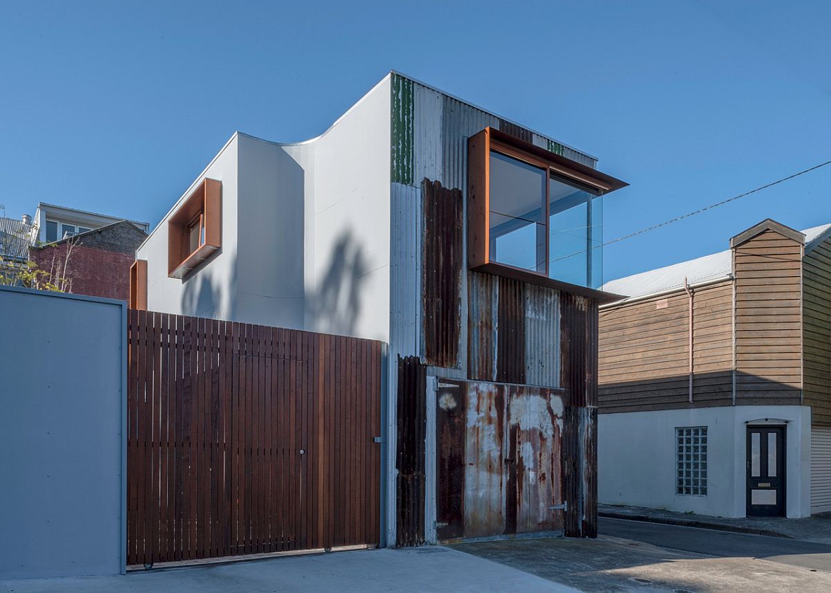 Street facade of the Tinshed in Sydney is covered with metal salvaged from old tinshed