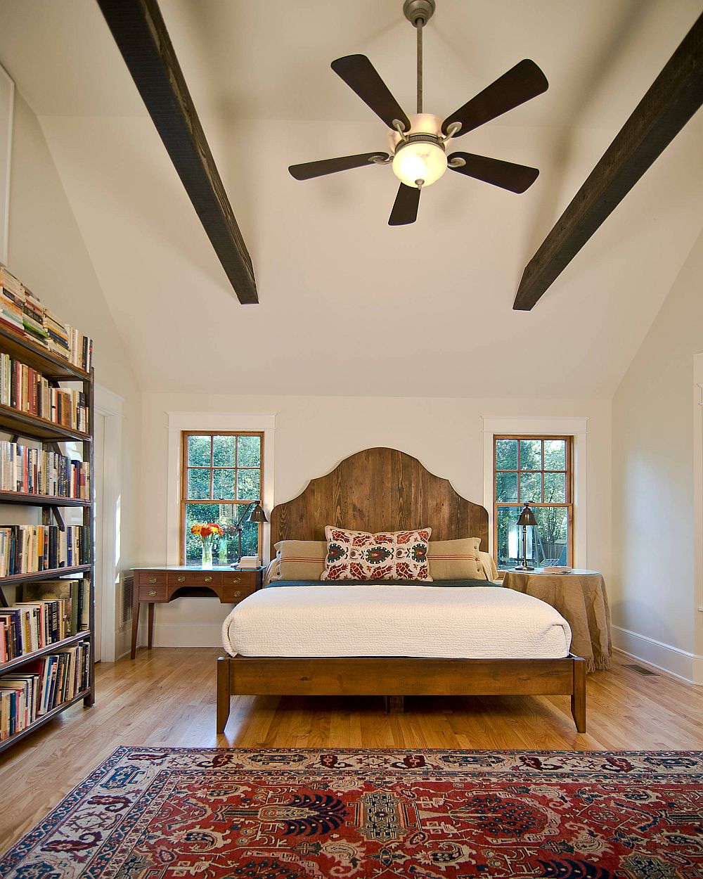 Striking-dark-wooden-beams-add-visual-contrast-to-the-bedroom-while-giving-it-a-classic-appeal
