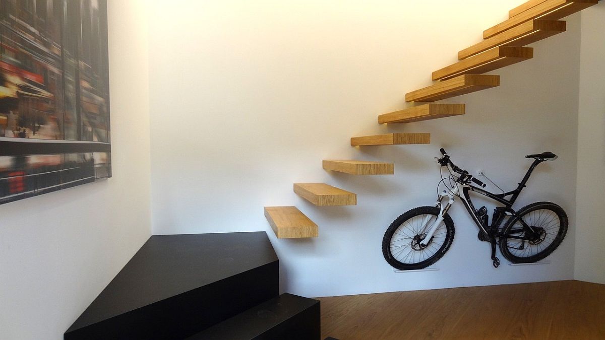 Stunning contemporary minimal staircase in wood connecting the lower box with the upper level