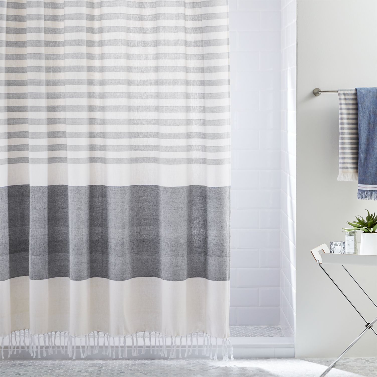 Tasseled shower curtain with grey stripes