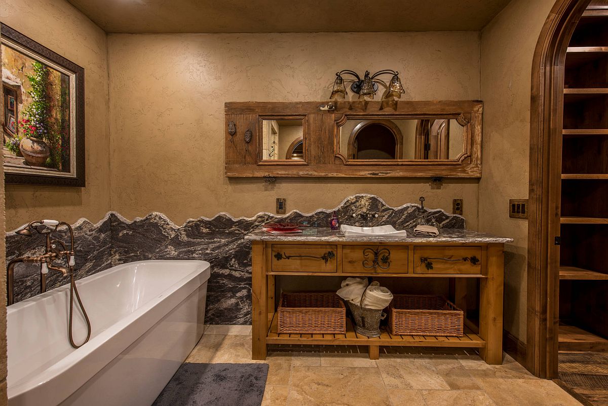 Textured walls bring beauty to the modest rustci bathroom with earthen tones