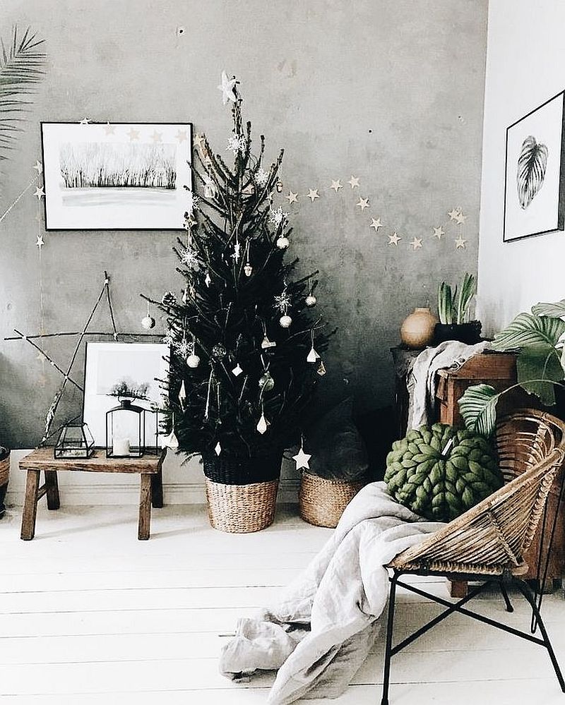 Black Christmas tree with silver decorations.